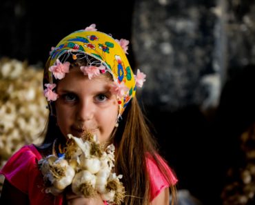 Girl gives garlic, Reasons Why You Should Consume Black Garlic