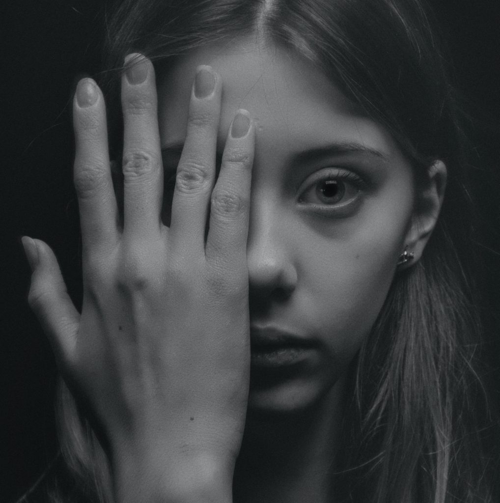 Poor hair and nail growth, woman with her hand